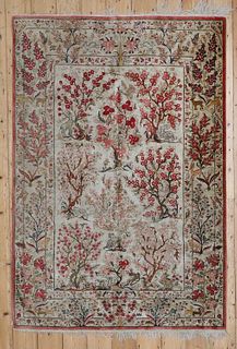 A Persian silk rug,