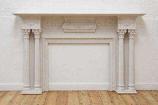 A white-painted fire surround,