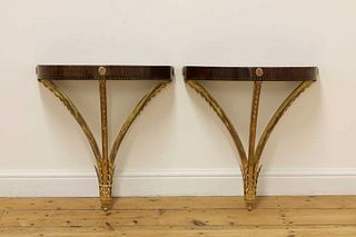A pair of demilune console tables,