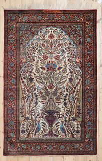 A Persian silk carpet,