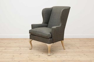A wing back armchair,