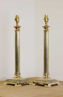 A pair of brass candlestick lamps,