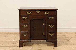 A George III and later mahogany kneehole desk,