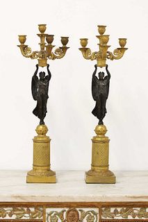 A pair of Empire D'or ormolu and bronze candelabra,