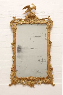 A carved giltwood pier mirror,