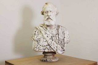 A marble bust of a bearded man,