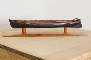 A wooden model of a Thames rowing cutter,