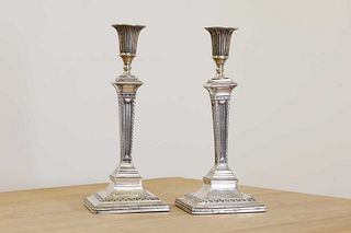 A pair of George III silver table candlesticks,
