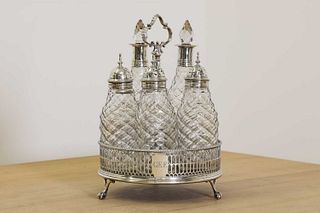 A George III silver five-bottle cruet stand,