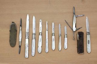 A small collection of mother-of-pearl-handled folding fruit knives,
