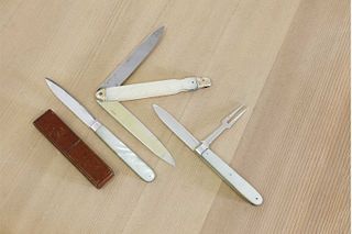 Three silver and mother-of-pearl folding fruit knives,