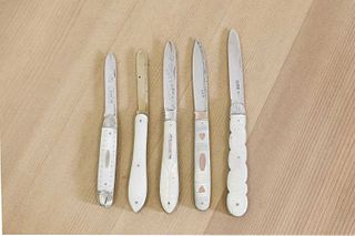 Five silver and mother-of-pearl folding fruit knives,