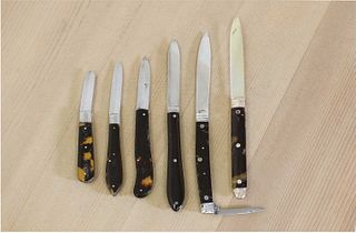 Six tortoiseshell and silver folding fruit knives,