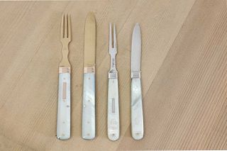 Two pairs of silver and mother-of-pearl folding fruit knives and forks in leather cases,