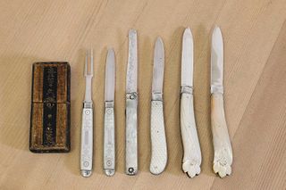 Four silver and mother-of-pearl folding fruit knives and a pair,