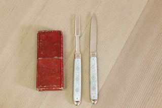 A gold and mother-of-pearl folding fruit knife and fork,