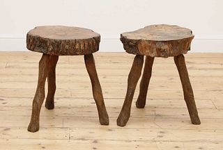 A pair of rustic tree slice occasional tables,