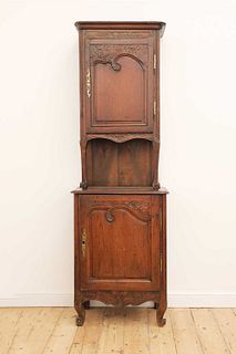 A French provincial pine and walnut cupboard,