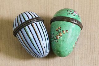 Two George III enamel egg-shaped nutmeg graters,
