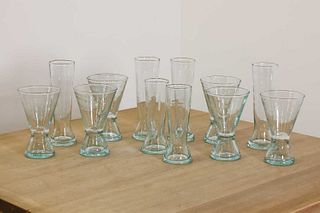A set of twenty-eight clear glasses,