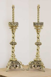 A pair of impressive brass altar stick lamps,