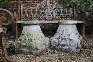 A pair of carved marble capitals,