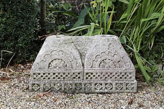 A carved stone double-column base,