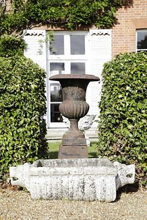 A cast iron urn,