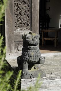 A pair of carved lava stone Dogs of Fo,
