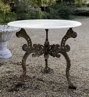 A marble-topped iron garden table,