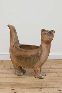 A terracotta planter in the form of a cat,