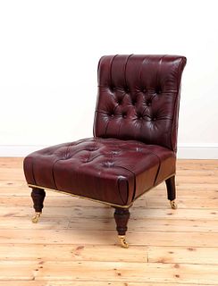 A leather button-upholstered slipper chair,