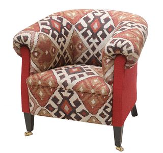 An upholstered armchair,