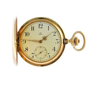 A full hunter pocket watch by Omega. Yellow metal case, stamped 14K 0,58 with poincon. Signed keyles