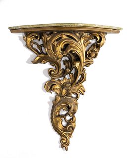 A carved giltwood wall-mounted console table