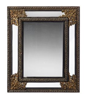 A Flemish-style brass wall mirror