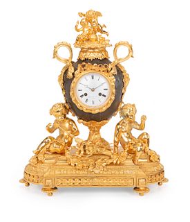 A Guyerdet Aine gilt-bronze clock