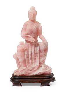 A carved rose quartz Guan Yin