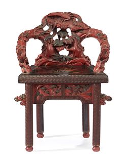 A Chinese carved wood and cinnabar armchair