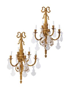 A pair of gilt-bronze and crystal wall sconces