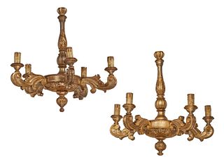 A pair of Italian carved giltwood chandeliers