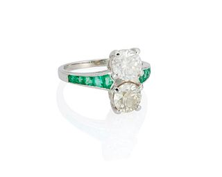 A twin stone diamond and emerald ring
