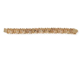 A diamond and gold freeform bracelet