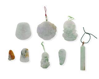 Eight carved jadeite pendants