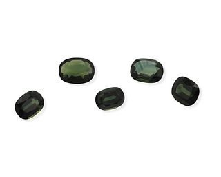 Five unmounted green sapphires