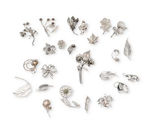 A large mixed group of botanical themed silver brooches