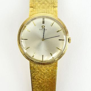 Men's Vintage Omega 14 Karat Yellow Gold Manual Movement Watch with Flexible Link Bracelet.