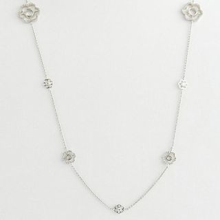 18 Karat White Gold Necklace accented with small Round Cut Diamonds.