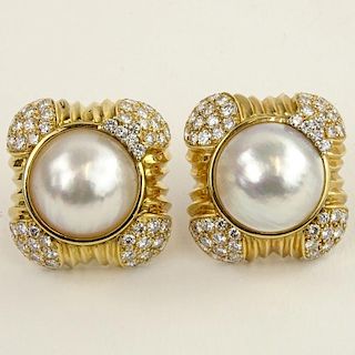 Pair of Lady's Large Mabe Pearl, 5.70 Carat Round Cut Diamond and 14 Karat Yellow Gold Gold Earrings.