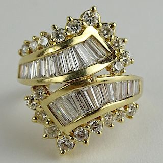 Lady's Vintage Approx. 3.0 Carat Round and Baguette Diamond 14 Karat Yellow Gold Cross Over Ring.